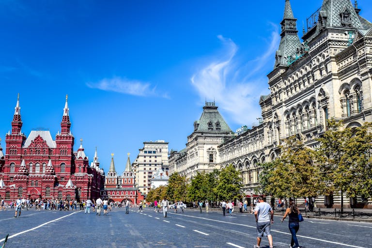 Red Square, Moscow captured on a bright day with tourists, historic architecture, and clear skies.