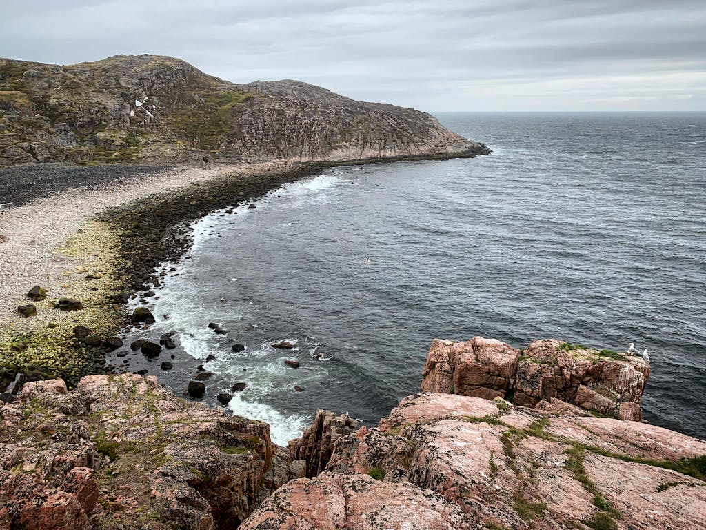 Rugged cliffs and shoreline of Teriberka, Russia, on the Barents Sea