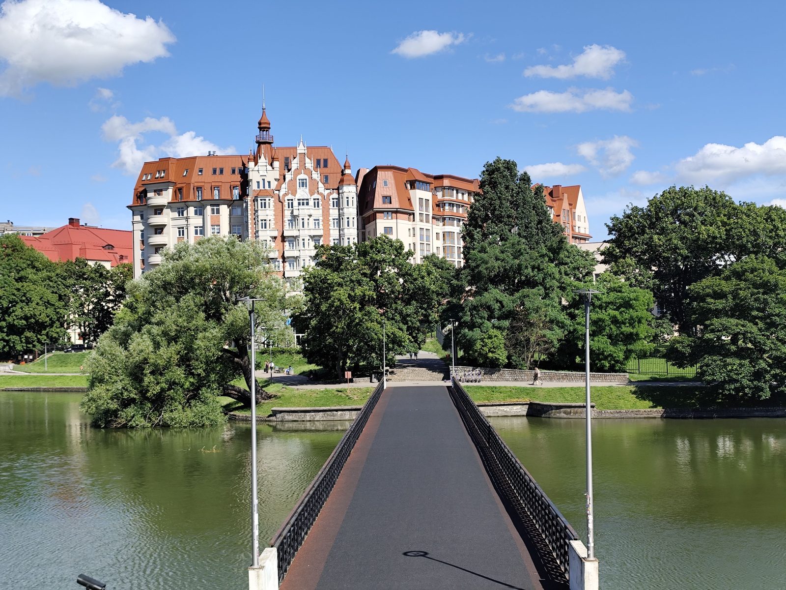 Pond with a footbridge and German-style buildings in Kaliningrad